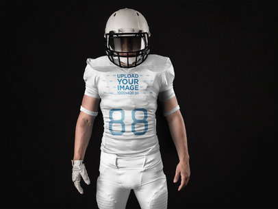 Custom Football Uniform Designer - Man Standing with Helmet On