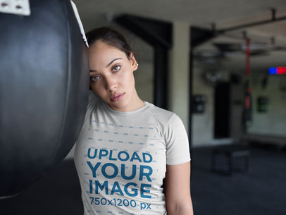 Sports Mockup of a Beautiful Woman Resting at the Gym While Wearing Custom Sportswear