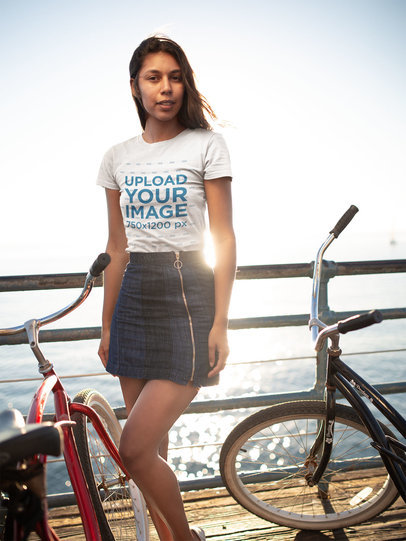 T-Shirt Mockup of a Woman at a Pier with Two Bikes