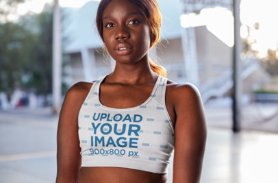 Athletic Bra Mockup Featuring a Woman on the Street