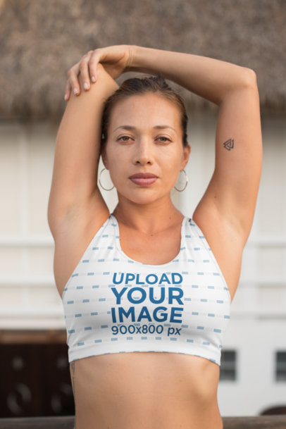 Sports Bra Mockup of a Woman Stretching Her Shoulder 