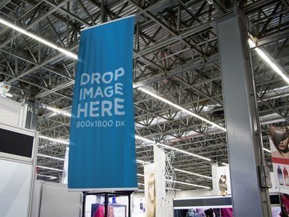 placeit vertical banner template hanging from a light pole near a